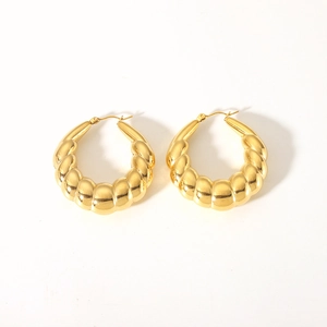 Close-up of 18K gold plated stainless steel hoop earrings with a twisted croissant design