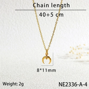 Detailed view of gold horn pendant necklace with cubic zirconia and chain length dimensions