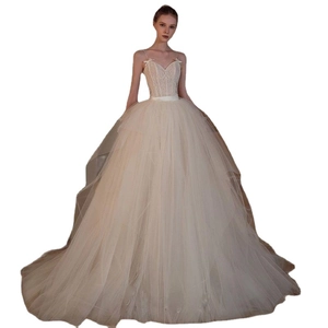 Elegant ivory lace ball gown wedding dress with spaghetti straps and deep V-neckline