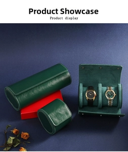Detail of dark green leather watch roll set with fine white stitching and soft lining