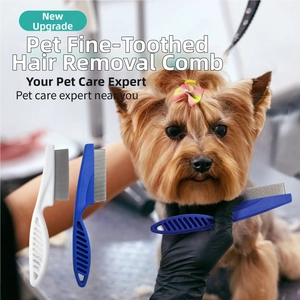 Close-up of fine-tooth pet grooming comb removing fleas from small dog fur