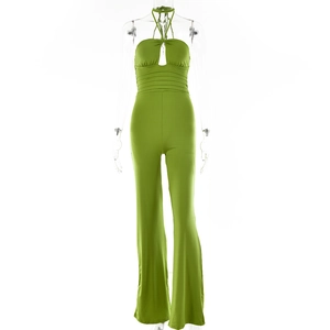 Detail of green halter jumpsuit showing hollow-out chest with lace-up ties and ruched waist