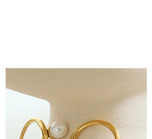 Close-up of golden necklace with natural freshwater pearl pendant on neck