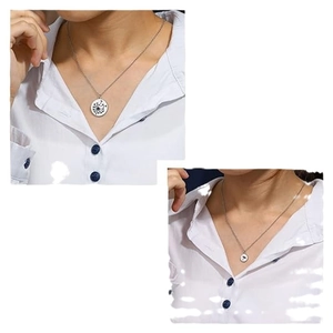 Minimalist silver stainless steel dandelion pendant necklace set shown on a white shirt