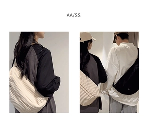 Corduroy crossbody bag detail showing wide strap and ribbed texture on beige and black models