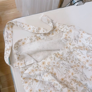 Detail of floral rabbit print on a minimalist cream cotton canvas tote shoulder bag