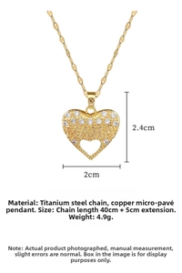 Detail of gold heart pendant with MAMA engraving and cubic zirconia stones on titanium chain