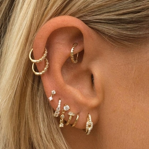 Close-up of model wearing gold-plated S925 silver fringe earrings with cubic zirconia