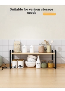 Detail of a 2-tier kitchen counter rack with black metal frame and wood shelves