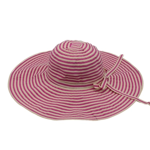 Detail of striped sun hat with pink ribbon bow and textured woven wide brim