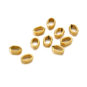 Detailed macro view of nine polished gold-plated stainless steel jewelry clasps on white