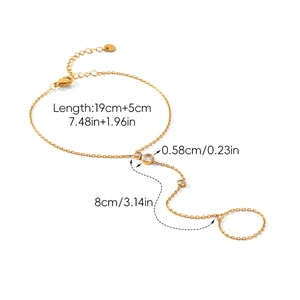 Macro detail of gold finger chain bracelet with dimensions and sparkling cubic zirconia