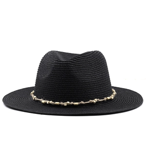 Detail of black straw fedora with hemp rope band and light wood beads ornament