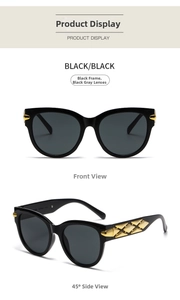 Detail view of oval sunglasses with gold diamond texture decoration on the black temples
