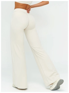Detail of high waist yoga pants showing peach butt lifting seams and contrast stitching