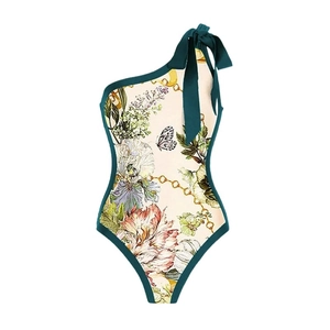 Floral print one-shoulder swimsuit with bow tie and vintage pattern on white background