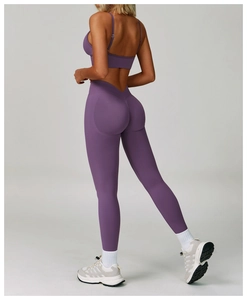 Rear view of purple seamless yoga set showing high waist V-cut leggings and lifting effect