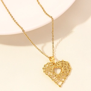 Gold hollow lattice heart necklace with polished inner pendant and delicate chain