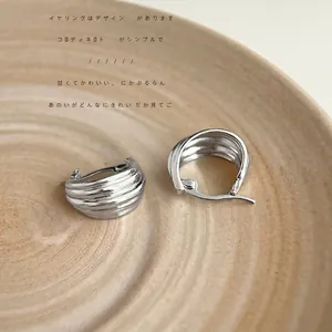 French vintage style silver hoop earrings with textured pleated metal design for women
