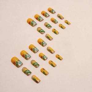 Medium-length corn yellow press-on nails with autumn harvest theme and glitter finish