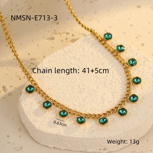 Detail of gold adjustable chain with 0.63cm green gemstone pendants and size markings