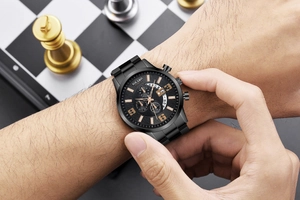 Detail of Yolako men's chronograph watch showing black metal strap and rose gold markers