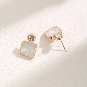 Elegant rose gold square shell earrings with round zircon inlay on a white textured backdrop