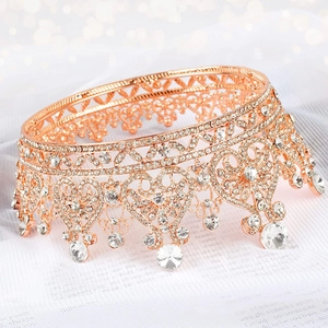 Macro detail of rose gold bridal crown featuring heart motifs and sparkling rhinestones