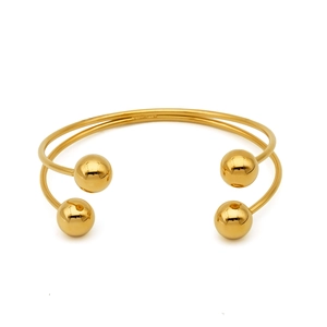 Minimalist double-layered golden stainless steel open cuff bracelet with four spherical ends