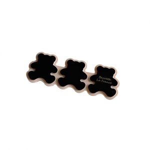 Three linked black bear hair clips with gold Barrette La France text on white background
