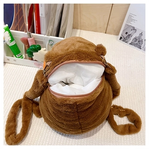 Detail view of the plush capybara backpack showing open zipper and inner mesh lining