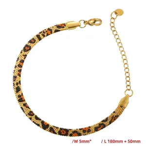 Detailed view of a 5mm gold snake chain bracelet featuring an orange and black leopard pattern