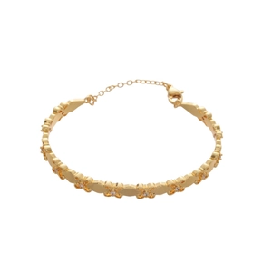 18k gold plated fleur-de-lis open bangle with zircon accents and lobster clasp closure