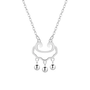 Detailed shot of a silver Ruyi lock pendant made of s925 sterling silver with three beads