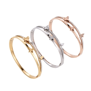 Three-color butterfly titanium steel bangle set in gold, silver, and rose gold finish