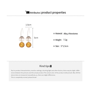 Detailed view of amber yellow rhinestone fringe earrings with dimensions and product specifications