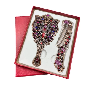 Vintage peacock metal makeup mirror and comb set in a luxury red gift box packaging