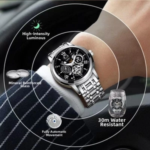 Wrist shot of ORUSS automatic mechanical watch with luminous dial in a car setting