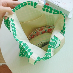 Interior view of cotton tote bag with geometric patterns and inside pocket storage