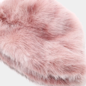 Close-up of soft light pink faux fur texture on a winter fisherman hat detail