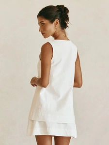 Women's minimalist white sleeveless vest top and A-line skirt set in natural linen fabric