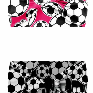 Macro detail of elastic sports headbands featuring football patterns in red and black