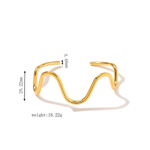 Detail view of 18k gold plated wave bangle with measurements 28.22mm and 18.22g weight