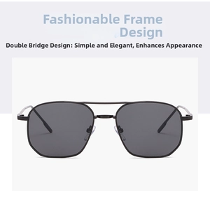 Detail of black double-bridge metal frame sunglasses with dark tinted fashion lenses