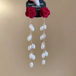 Elegant red flocked rose earrings with long gold tassel chains and white pearls