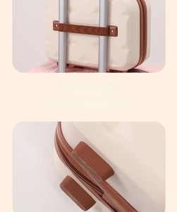 Mini macaron hardshell toiletry bag featuring an elastic strap for luggage handles