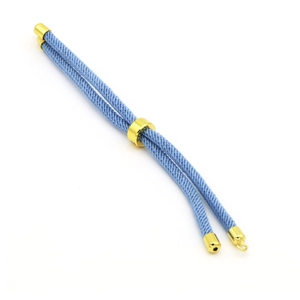 Macro detail of blue spiral woven DIY bracelet string with gold adjustable sliding buckle
