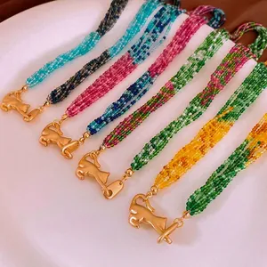 Multi-strand crystal bead necklace with gold leopard clasp in various pastel colors