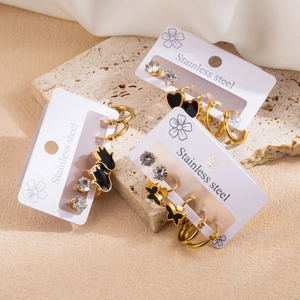 Minimalist stainless steel earring set with black enamel heart, butterfly and palm charms