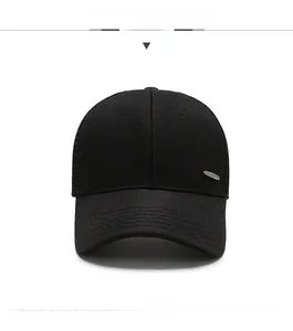 Front view of black mesh baseball cap showing reinforced stitching and metal logo